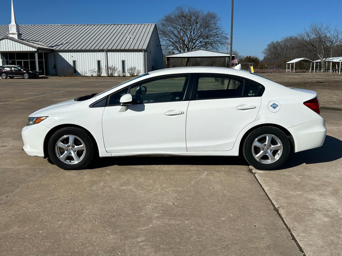 2012 White /Gray Honda Civic CNG Sedan 5-Speed AT (19XFB5F53CE) with an 1.8L L4 SOHC 16V CNG engine, 5-Speed Automatic transmission, located at 17760 Hwy 62, Morris, OK, 74445, (918) 733-4887, 35.609104, -95.877060 - 2012 HONDA CIVIC 1.8L FWD DEDICATED CNG (COMPRESSED NATURAL GAS) VEHICLE. FEATURES REMOTE KEYLESS ENTRY, POWER LOCKS, POWER WINDOWS, POWER MIRRORS, MANUEL SEATS, AM/FM RADIO, CD PLAYER, USB, AUX, BLUETOOTH FOR HANDS-FREE CALLING, 12V POWER OUTLET, CRUISE CONTROL, TRACTION CONTROL, AND CLOTH SEATS. 1 - Photo#7